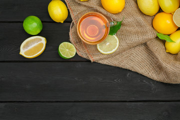 lemon tea with lemon and lime on wooden table