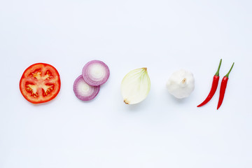 Various fresh vegetables on white.