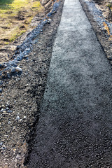 New asphalt on a pedestrian road as a background