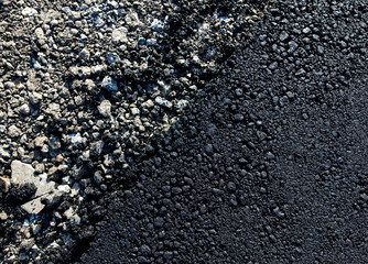 Stones on the edge of the asphalt road