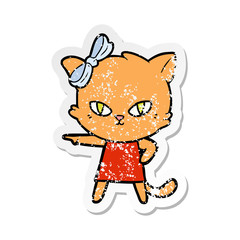 Obraz na płótnie Canvas distressed sticker of a cute cartoon cat wearing dress