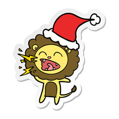 sticker cartoon of a roaring lion wearing santa hat