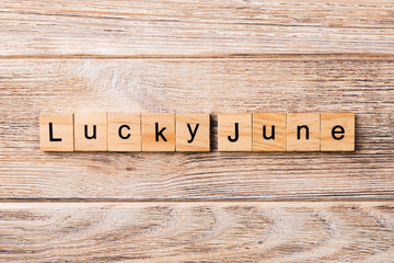 lucky June word written on wood block. lucky June text on table, concept