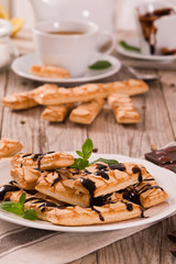 Puff pastry cookies with chocolate icing.