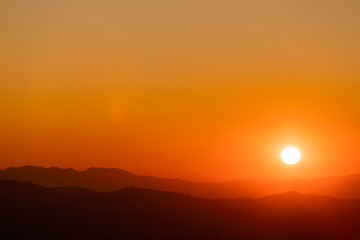 colorful dramatic sky with cloud at sunset.