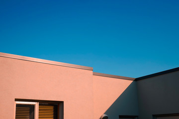 Modern and minimal residential building with light and shadow, summer background