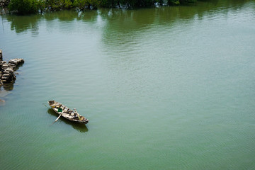 Fisher boat on the still river