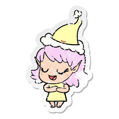 happy distressed sticker cartoon of a elf girl wearing santa hat