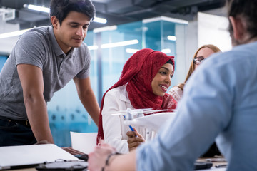 multiethnic business team learning about drone technology