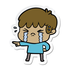 sticker of a cartoon boy crying