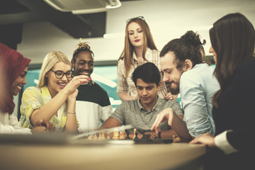multiethnic group of business people playing chess
