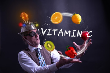 Funny nerd or geek juggles with fruits and vegetables vitamin c