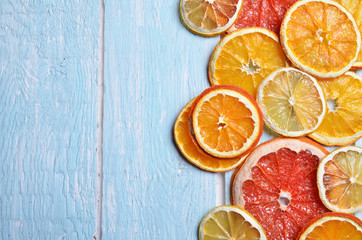 Slice of dried orange,lemon, grapefruit  on a blue background