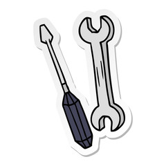 sticker cartoon doodle of a spanner and a screwdriver