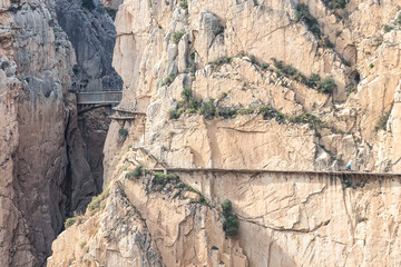 El Caminito del Rey (The King's Little Path) with Bridge in gorge of the Gaitanes. A walkway, pinned along the steep walls of a narrow gorge in El Chorro, near Ardales in the province of Malaga, Spain