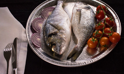 fresh fish in a silver plate