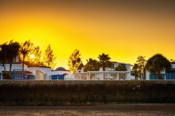 Village of Santorini Houses Styles on The Beach at Sunset Scene, Traveling Destination and Holiday in Summer Time.Vacation tourism Concept