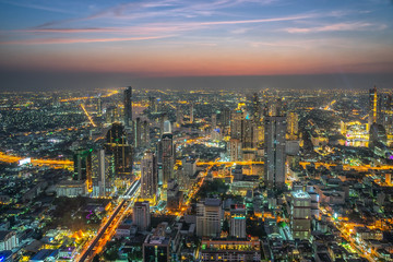Fototapeta na wymiar Bangkok city. Cityscape of Bangkok modern office buildings at night, Thailand.
