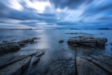 Sea rocks. Calm sea and empty beach. On the beach with blue sea blue sky for vacation.