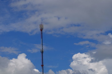 Wireless Communication Antenna With bright sky.Telecommunication tower with antennas with blue sky.