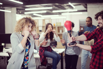 multiethnics business team boxing at office