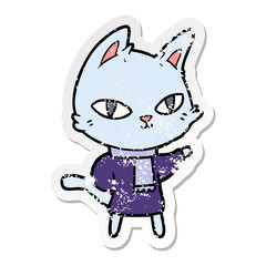 distressed sticker of a cartoon cat staring