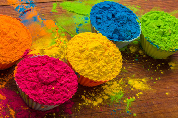 Holi color powder. Organic Gulal colours in bowl for Holi festival, Hindu tradition festive
