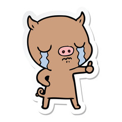 sticker of a cartoon pig crying