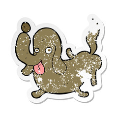 retro distressed sticker of a cartoon dog sticking out tongue