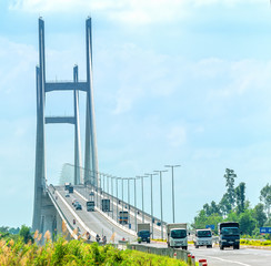 Dong Thap, Vietnam - January 17th, 2019: Traffic on Cao Lanh bridge cable stayed on the Mekong River in the morning connects the city of Cao Lanh and Lap Vo District, Dong Thap, Vietnam
