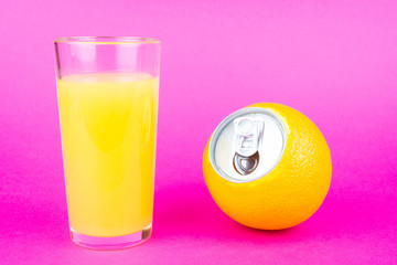 Orange juice on pink background