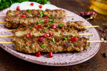 Lula kebab is a traditional Arabic dish. Meat shashlik on wooden skewers.