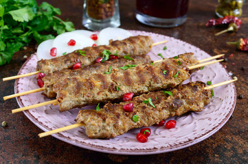 Lula kebab is a traditional Arabic dish. Meat shashlik on wooden skewers.