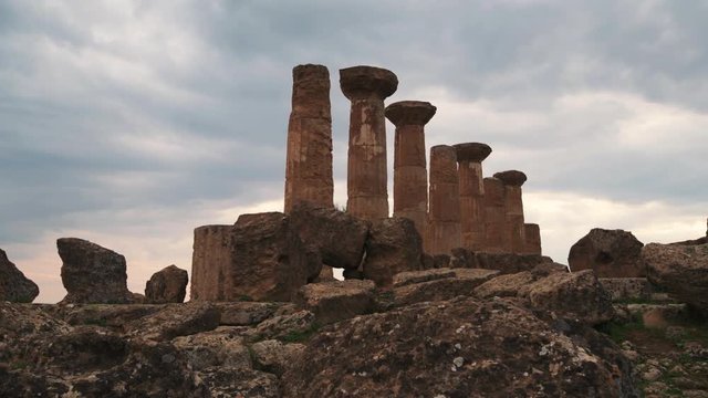 Panning view of Greek temple of Juno in the valley of temples in Sicily at sunset