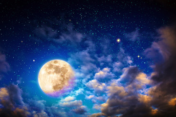 Fototapeta na wymiar Dark night sky with stars with big clouds and full moon.