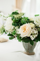 wedding table decorated by plates, knives and forks