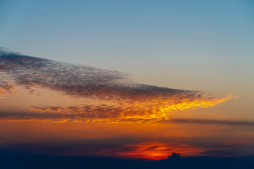 Sunny shine on clouds. Wonderful vivid dawn. Beautiful calm sunset. Scenic tranquil sunrise. Amazing peaceful cloudy sky. Sun above horizon. Picturesque sundown. Atmospheric cloudscape. Background.