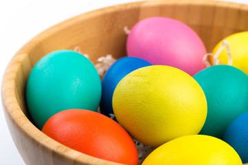 Fototapeta na wymiar easter eggs in wooden bowl