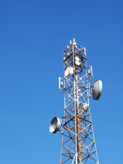 Communication tower with sunset blue sky background