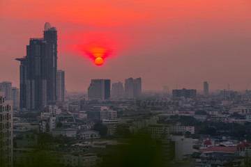 Fototapeta premium The background of the high angle view in the evening, overlooking the condominium that is under construction in a variety of heights, showing the habitat of the capital city.