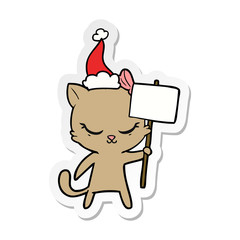 cute sticker cartoon of a cat with sign wearing santa hat