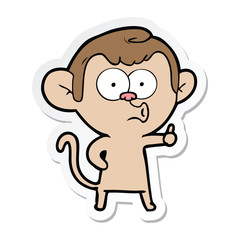 sticker of a cartoon hooting monkey