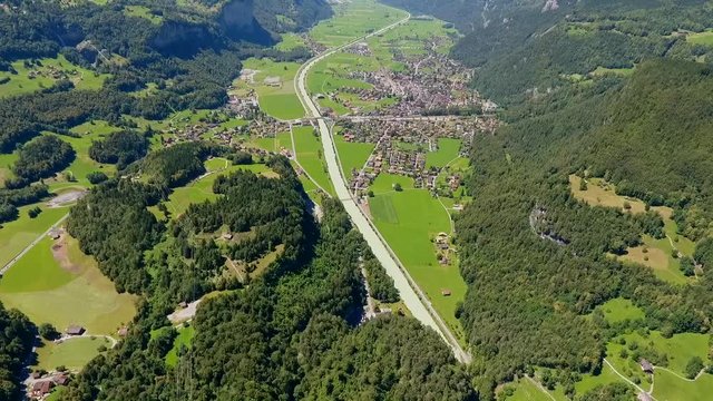 A birds-eye view of the surrounding trees and road. in Bern Vally of zweisimmen