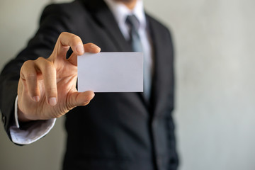 Man's hand showing business card,businessman holding blank visit card,Businessman showing blank business card isolated on white background.