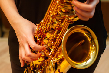 woman playing saxophone