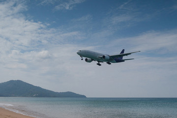 Fototapeta na wymiar Airplane is landing at Thailand May Khao airport