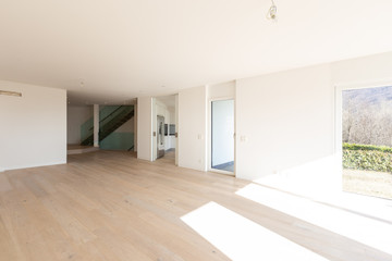 Empty white living room interior with parquet