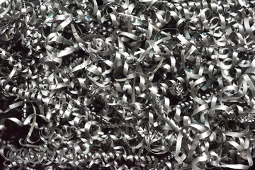 A lot of metal shavings after working on a milling machine or CNC machine. Metal shavings texture