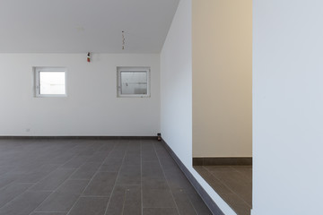 Cellar with gray tiles and white walls