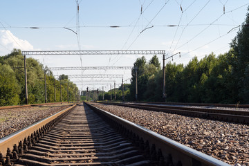  Summer spring railway station and carriages. Railway landscape with perspective and lines.